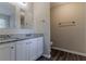 Bathroom featuring granite countertops, double sinks, and modern fixtures for a luxurious feel at 1363 To Lani Farm Rd, Stone Mountain, GA 30083