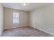 Inviting bedroom with neutral carpet, a bright window, and ample space for personalized decor at 1363 To Lani Farm Rd, Stone Mountain, GA 30083