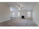 Spacious living room with fireplace, carpet and hardwood flooring, and natural light at 1363 To Lani Farm Rd, Stone Mountain, GA 30083