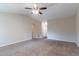 Spacious living room with carpet, neutral paint, and ceiling fan at 1363 To Lani Farm Rd, Stone Mountain, GA 30083