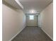 View of the finished basement with neutral paint, carpet, and a window for natural light at 2032 Parker Ranch Se Rd, Atlanta, GA 30316