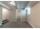 Finished basement space with carpet, neutral paint, and access to additional rooms at 2032 Parker Ranch Se Rd, Atlanta, GA 30316
