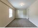Bedroom features a closet with white doors, neutral walls and plush gray carpeting throughout at 2032 Parker Ranch Se Rd, Atlanta, GA 30316