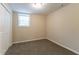 Bedroom featuring neutral walls, carpet, and a window for natural light at 2032 Parker Ranch Se Rd, Atlanta, GA 30316