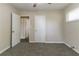 Bedroom with natural light, neutral walls, plush carpet, and a white door at 2032 Parker Ranch Se Rd, Atlanta, GA 30316