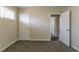 Bedroom with natural light, neutral walls, plush carpet, and a white door at 2032 Parker Ranch Se Rd, Atlanta, GA 30316