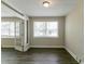Bright room with laminate floors, fresh paint, and large windows for natural light at 2032 Parker Ranch Se Rd, Atlanta, GA 30316