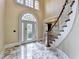 Spacious foyer featuring marble floors and a front door at 320 Chason Wood Way, Roswell, GA 30076