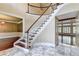 Grand foyer featuring a sweeping staircase and marble floors at 320 Chason Wood Way, Roswell, GA 30076