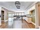 A spacious kitchen has white cabinets, stainless appliances, hardwood floors and lots of natural light at 320 Chason Wood Way, Roswell, GA 30076