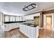 Spacious kitchen features a large island, stainless steel appliances, and hardwood floors at 320 Chason Wood Way, Roswell, GA 30076