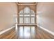 Bright living room featuring hardwood floors and large windows at 320 Chason Wood Way, Roswell, GA 30076
