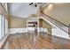 Bright open living room featuring a staircase, hardwood floors, and lots of natural light at 320 Chason Wood Way, Roswell, GA 30076