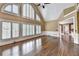 Bright living room with hardwood floors, large windows, and modern trim at 320 Chason Wood Way, Roswell, GA 30076