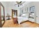 Bright bedroom with a large bed, rug, and artwork at 1455 Rucker Cir, Woodstock, GA 30188
