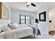 Serene bedroom featuring neutral decor, a window, and ensuite access to a full bathroom at 1455 Rucker Cir, Woodstock, GA 30188