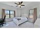 Inviting bedroom features natural light, neutral color palette, and plush carpeting at 1455 Rucker Cir, Woodstock, GA 30188