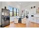 Bright breakfast nook with large window, wine storage, and seating area at 1455 Rucker Cir, Woodstock, GA 30188