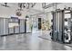 Organized garage space equipped with storage cabinets, workspace, and fitness equipment at 1455 Rucker Cir, Woodstock, GA 30188