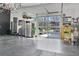 Well-lit garage with an epoxy floor, storage cabinets and a glass door at 1455 Rucker Cir, Woodstock, GA 30188