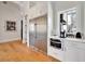 Gourmet kitchen featuring stainless steel refrigerator, microwave, and coffee bar area at 1455 Rucker Cir, Woodstock, GA 30188