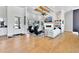Open living room with a fireplace, built-in shelves, and comfortable seating area at 1455 Rucker Cir, Woodstock, GA 30188