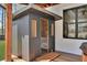 Private outdoor sauna next to a brick wall and wooden deck at 1455 Rucker Cir, Woodstock, GA 30188