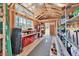 Organized shed interior with shelving, ample storage, and natural light at 1455 Rucker Cir, Woodstock, GA 30188
