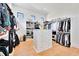 Spacious walk-in closet with custom shelves, drawers, and ample storage space at 1455 Rucker Cir, Woodstock, GA 30188