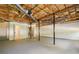 Unfinished basement with exposed ceiling and support beams, offering ample storage space at 201 Rustin Dr, Dallas, GA 30157