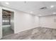 Finished basement featuring wood laminate flooring and access to the garage at 201 Rustin Dr, Dallas, GA 30157