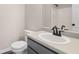 Bright bathroom featuring a shower-tub combo, black fixtures, and a modern sink with countertop at 201 Rustin Dr, Dallas, GA 30157