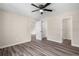 Spacious bedroom with a ceiling fan, laminate flooring, and neutral paint at 201 Rustin Dr, Dallas, GA 30157