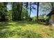 Lush backyard features mature trees and landscaping, creating a private and tranquil outdoor setting at 3031 San Jose Dr, Decatur, GA 30032