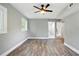 Light-filled bedroom with hardwood floors, grey walls, and walk-in closet at 3031 San Jose Dr, Decatur, GA 30032