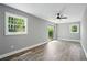 Bedroom features hardwood floors, ceiling fan and sliding glass door to the outside at 3031 San Jose Dr, Decatur, GA 30032
