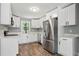 Updated kitchen with white cabinets, modern appliances, and plenty of counter space at 3031 San Jose Dr, Decatur, GA 30032