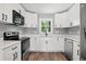 Well-equipped kitchen featuring white cabinets, modern appliances and a sleek design at 3031 San Jose Dr, Decatur, GA 30032