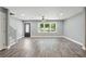 Newly renovated living room featuring hard surface floors, large windows, and modern ceiling fan at 3031 San Jose Dr, Decatur, GA 30032