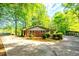 A charming brick home is surrounded by small, decorative shrubs at 1098 Cown Rd, Villa Rica, GA 30180