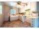 Retro kitchen design with neutral tones, laminate flooring, and vintage cabinetry at 1098 Cown Rd, Villa Rica, GA 30180