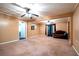Spacious living room with tan walls, plush carpeting, and cozy seating area at 1098 Cown Rd, Villa Rica, GA 30180