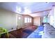 Living room showcasing multiple windows allowing for natural light; features carpeted flooring and neutral colored walls at 1098 Cown Rd, Villa Rica, GA 30180