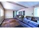 Living room featuring couches, multiple windows, and carpeted floors; a bright and open area at 1098 Cown Rd, Villa Rica, GA 30180