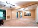 Expansive living room showcasing tan walls, plush carpeting and cozy seating arrangements at 1098 Cown Rd, Villa Rica, GA 30180
