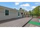 Deck with above ground pool, backyard, and the back of a house at 5185 Twin Oak Ne Dr, Woodstock, GA 30188