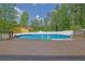 Backyard features a fenced above-ground pool and a wooden deck at 5185 Twin Oak Ne Dr, Woodstock, GA 30188