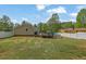 Backyard with a deck, above-ground pool and fenced yard at 5185 Twin Oak Ne Dr, Woodstock, GA 30188