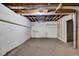 Unfinished basement with concrete floor, white walls, and exposed ceiling at 5185 Twin Oak Ne Dr, Woodstock, GA 30188