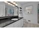 Bathroom showcasing granite countertop, white vanity and framed mirror at 5185 Twin Oak Ne Dr, Woodstock, GA 30188